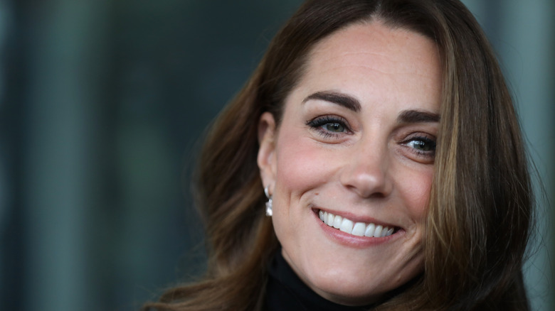 Kate Middleton smiles for photographers