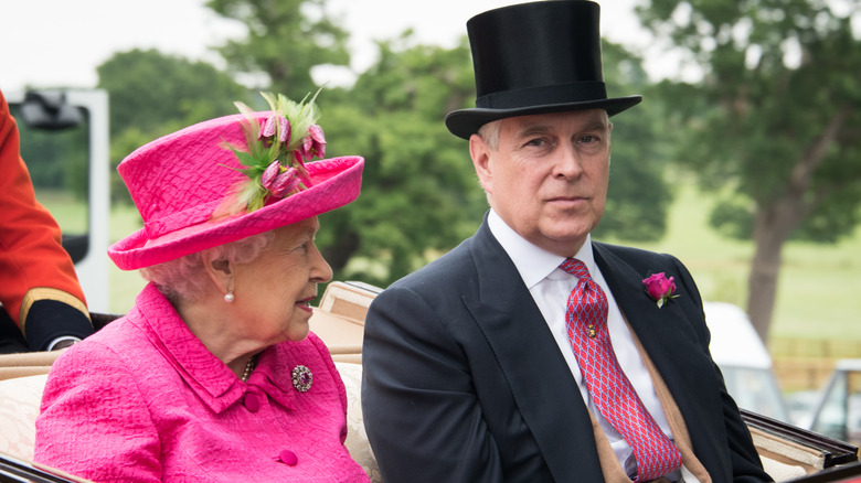 The Queen and Prince Andrew ride in a carriage