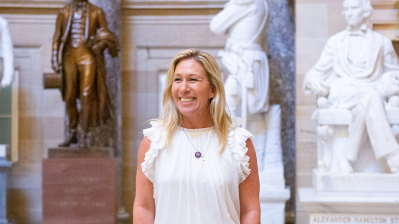 Marjorie Taylor Greene smiling in the U.S. Capitol building