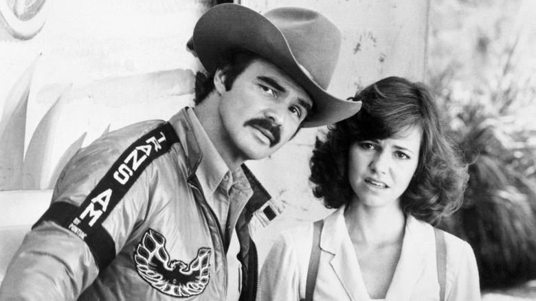 Burt Reynolds and Sally Field looking concerned in a scene from Smokey and the Bandit