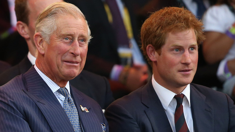 Prince Charles with son Prince Harry at an event