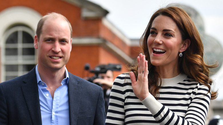 Prince William and Kate Middleton greet fans.