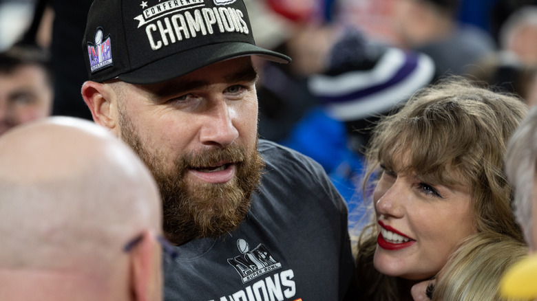 Travis Kelce and Taylor Swift smiling