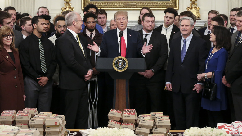 Trump addressing a crowd during the fast food feast he organized