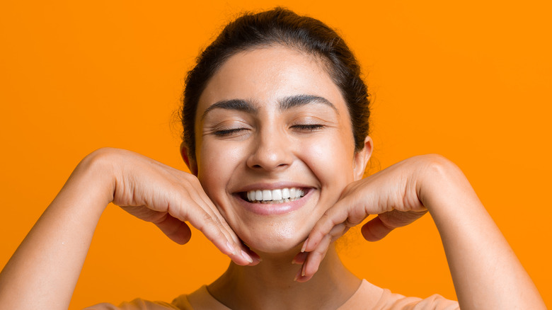 Woman doing face yoga