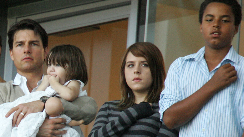 Tom Cruise and kids standing at event