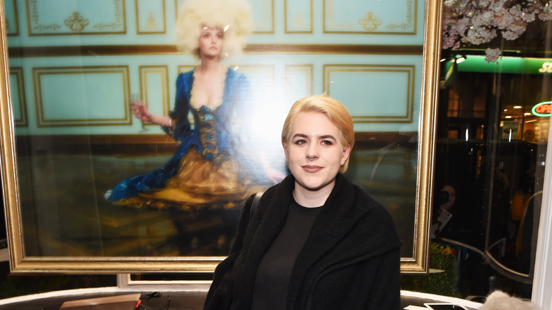 Isabella Cruise standing in front of painting