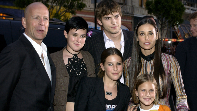 Ashton Kutcher with Demi Moore, Bruce Willis, and their daughters.