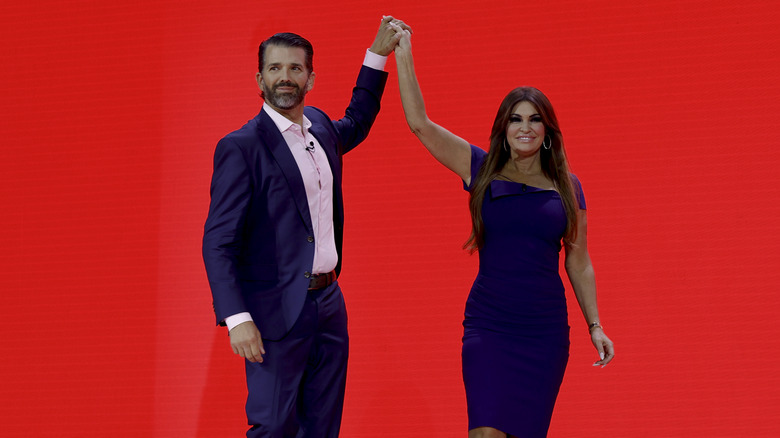 Donald Trump Jr. and Kimberly Guilfoyle holding hands