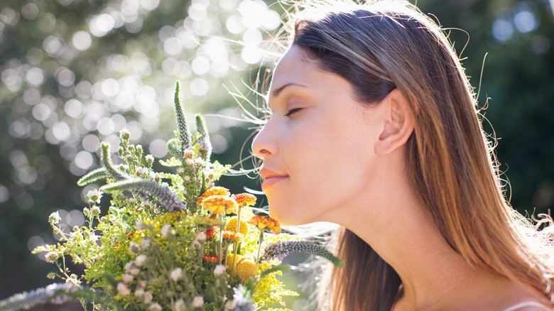 Woman smelling flowers