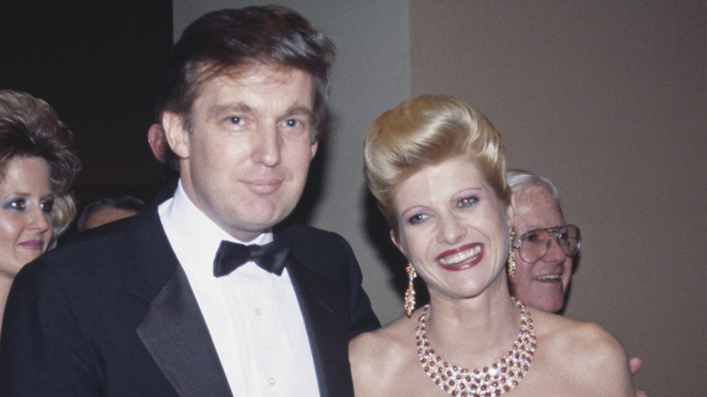 Donald and Ivana Trump smiles wearing formal clothing