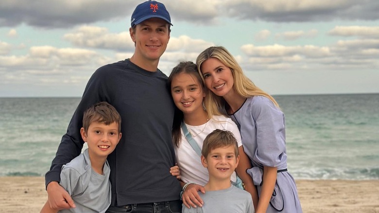 Ivanka Trump with Jared Kushner and their three children on the beach