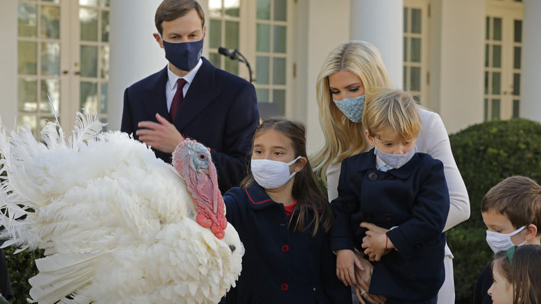 Ivanka Trump and family wearing masks pardoning Thanksgiving turkey