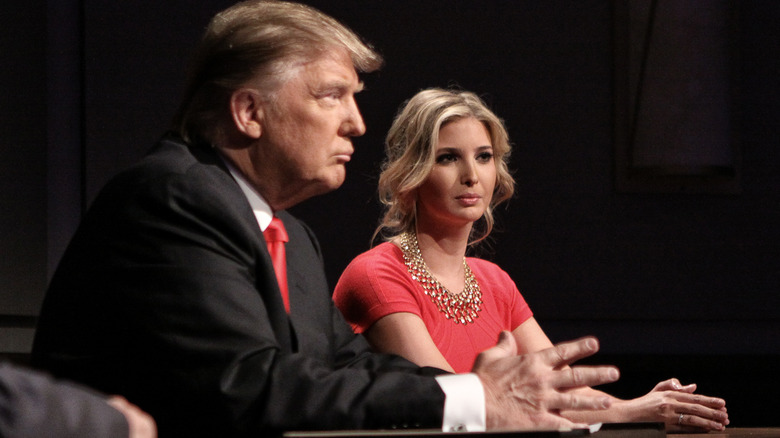 Donald Trump and Ivanka Trump sit at table 