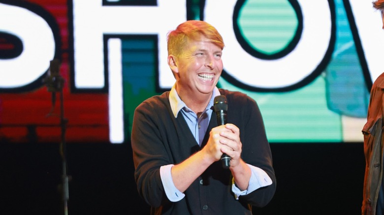 Jack McBrayer smiling with microphone