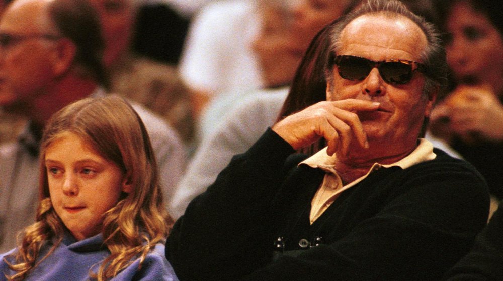 Jack Nicholson's daughter with her father at a game