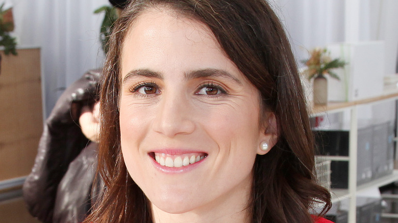 Tatiana Schlossberg sitting at a table