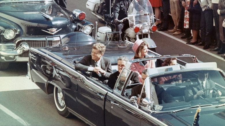 JFK and Jackie Kennedy ride through Dallas, Texas