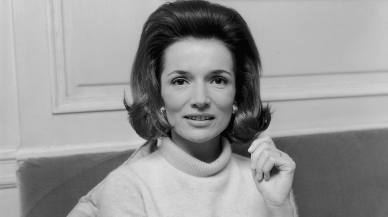 Lee Radziwill sitting on couch