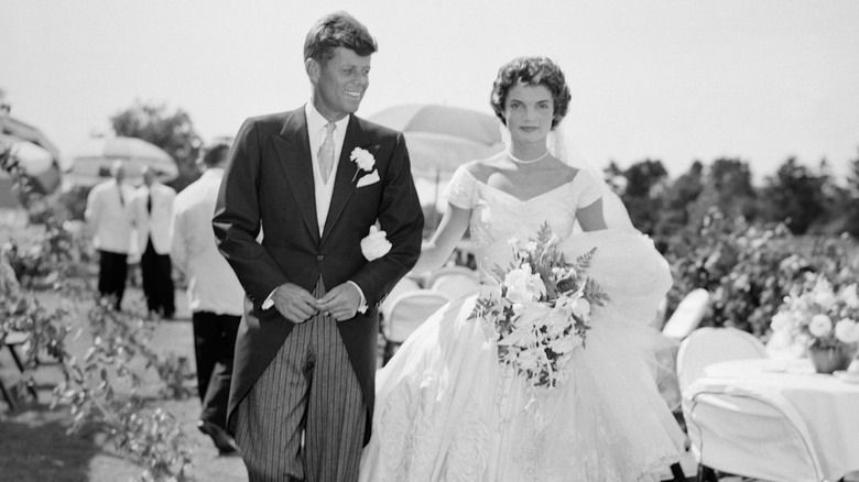 John and Jackie Kennedy walking arm in arm