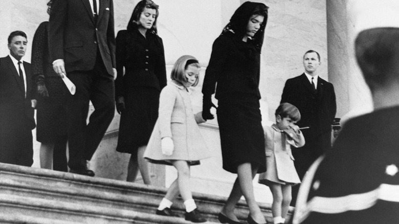 Jackie Kennedy walking with her two children