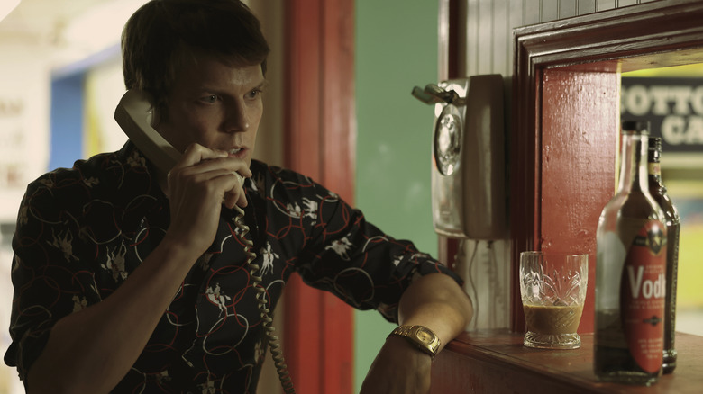 Jake Lacy as Bob Berchtold on phone in A Friend of the Family