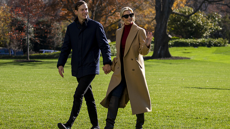 Ivanka Trump and Jared Kushner walking across lawn