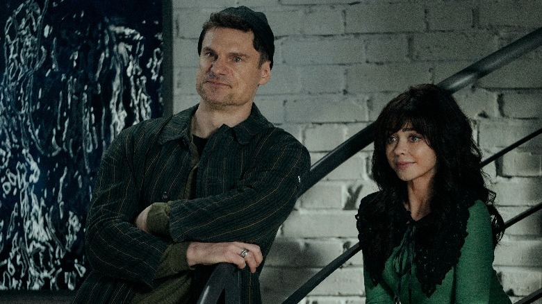 Flula Borg and Sarah Hyland posing by stairs in Pitch Perfect: Bumper in Berlin