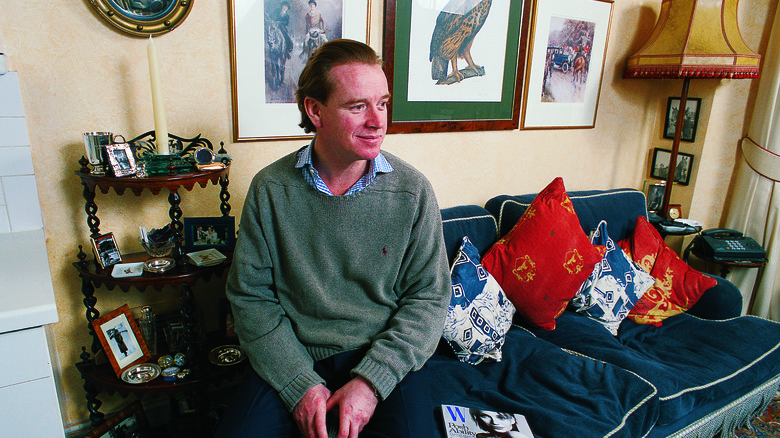 James Hewitt posing in his apartment