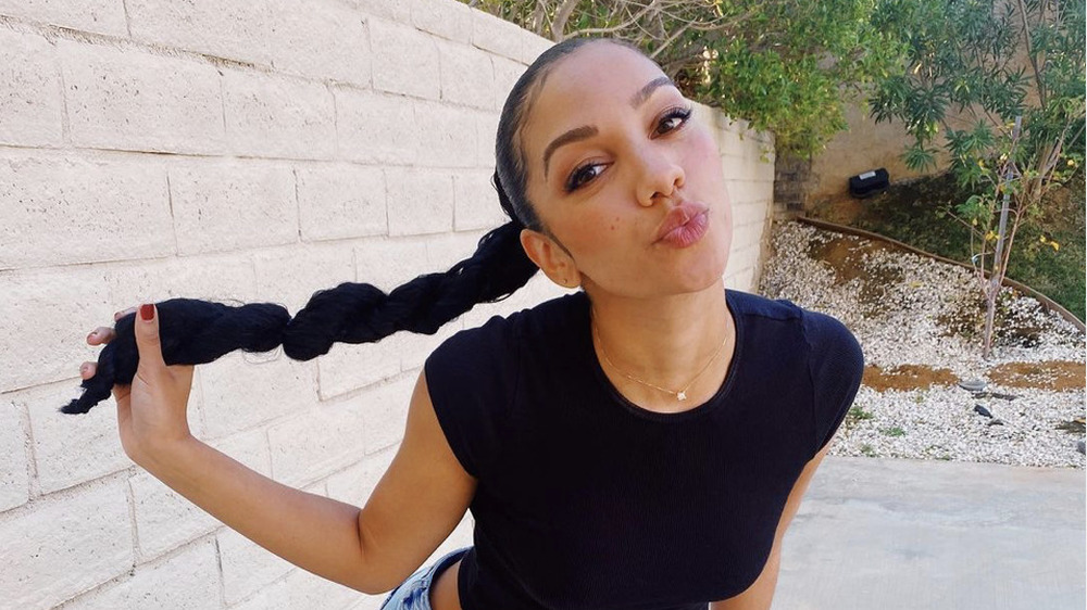 Corinne Foxx making a kiss face