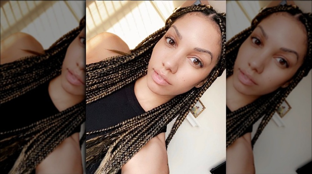 Corinne Foxx with her hair in long braids