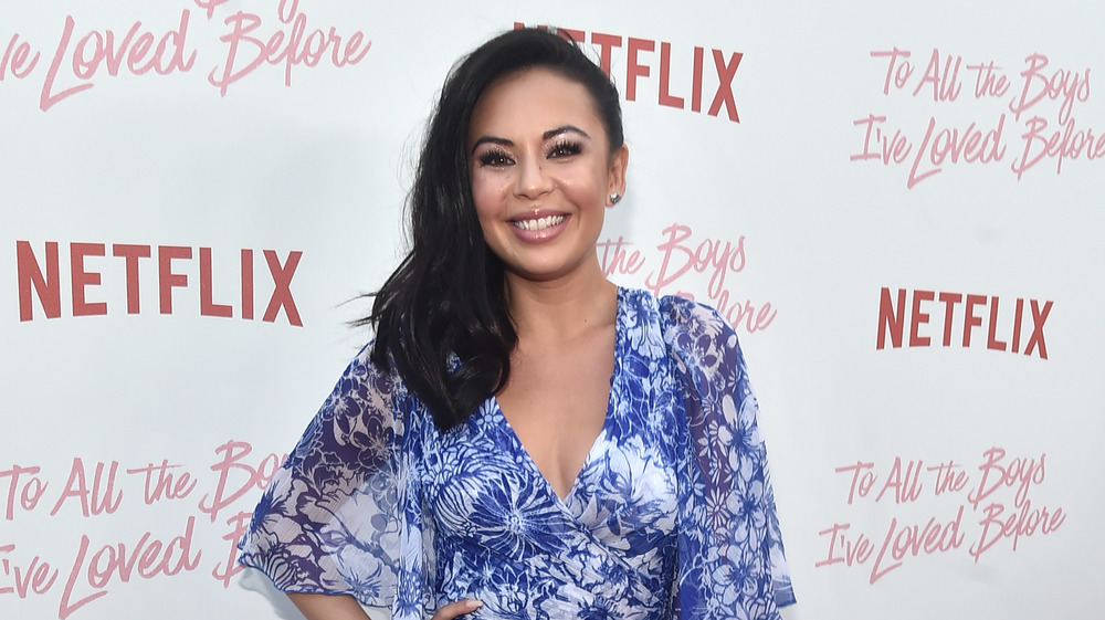 Janel Parrish smiling on the red carpet