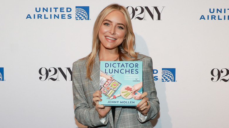 Jenny Mollen posing with her book