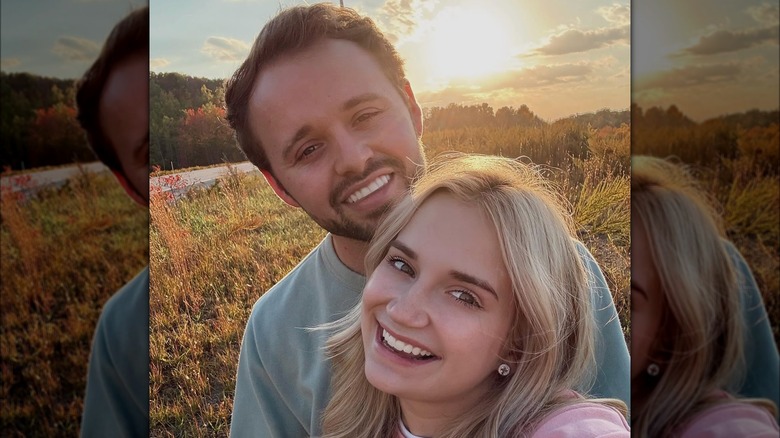 Jason Duggar and Maddie Grace Duggar taking a selfie at sunset