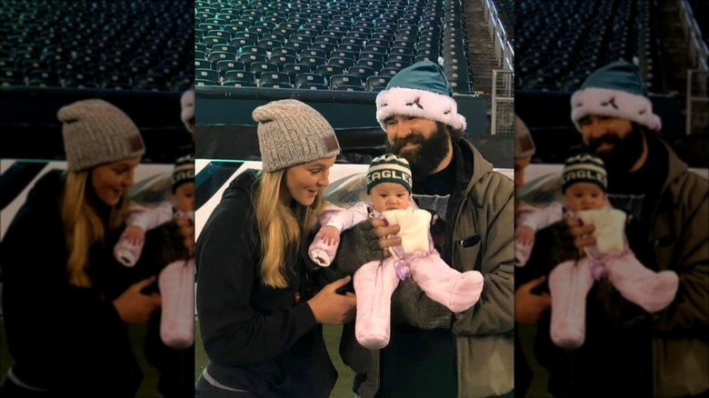 Jason and Kylie Kelce holding their daughter Wyatt