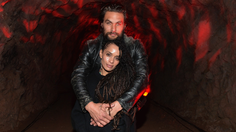 Jason Momoa hugs Lisa Bonet from behind