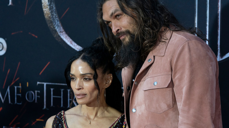 Jason Momoa and Lisa Bonet posing on the red carpet