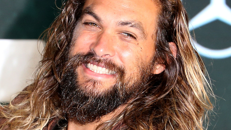 Jason Momoa smiles