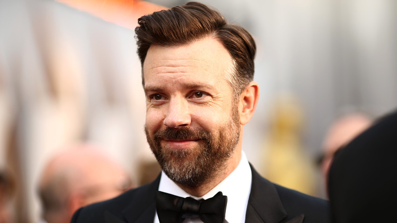 Jason Sudeikis smiles at an event