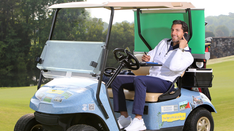 Jason Tartick on phone in Cubicle Caddie