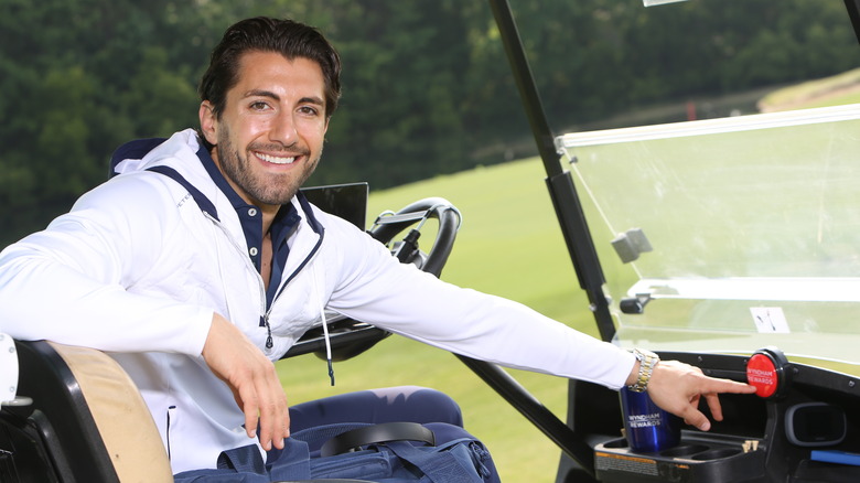 Jason Tartick pushing button in Cubicle Caddie