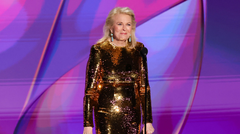 Candice Bergen smiling in a glittery metallic gown