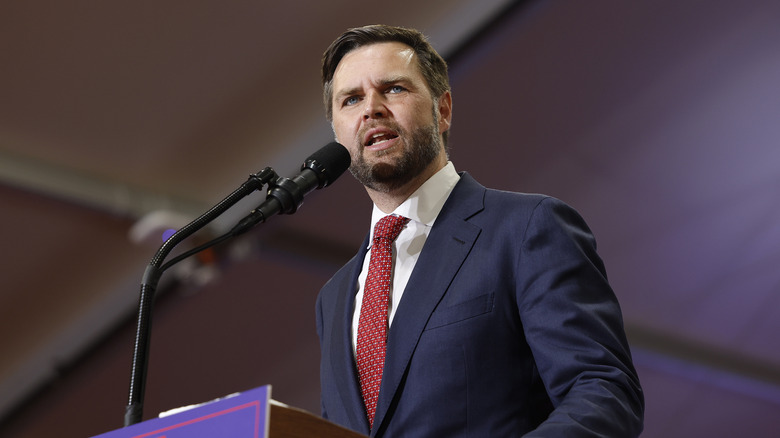 JD Vance speaking into a microphone 