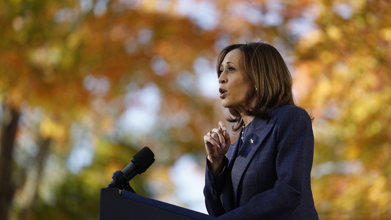 Kamala Harris speaking into microphone