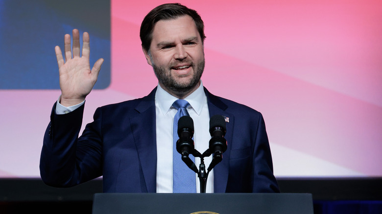 JD Vance waving at a podium