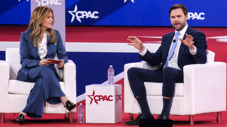 JD Vance sitting with Mercedes Schlapp at CPAC 2025