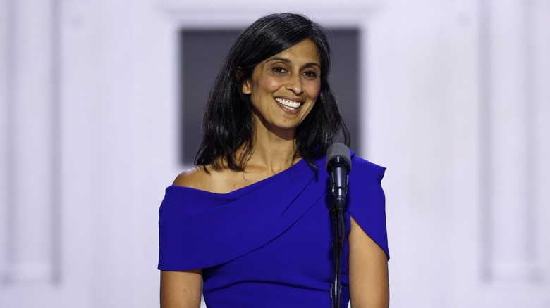 Usha Vance smiling at a podium