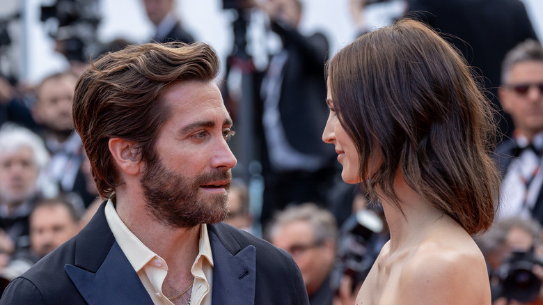 Jeanne Cadieu and Jake Gyllenhaal looking at each other