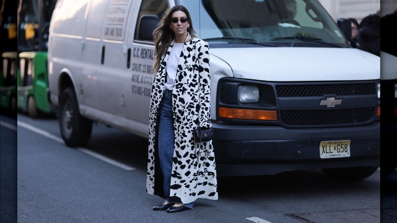 cow print coat with jeans and flats