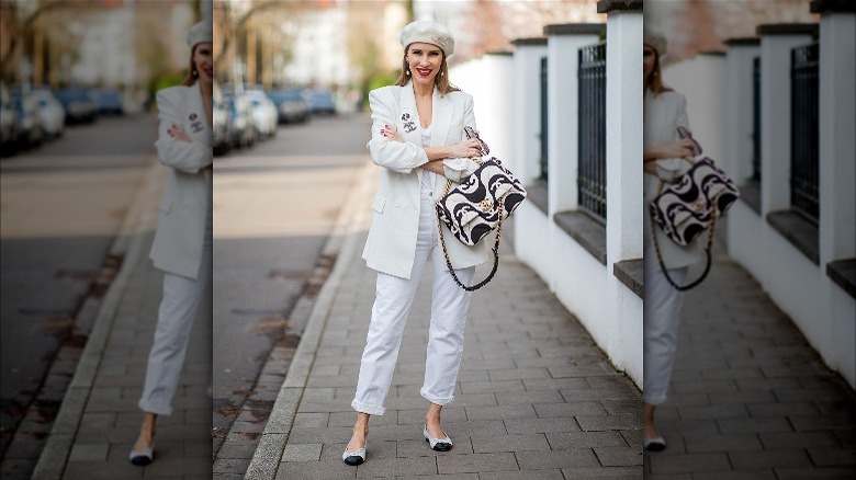 white jeans, tee shirt, blazer, and hat